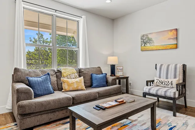a living room with furniture and a window