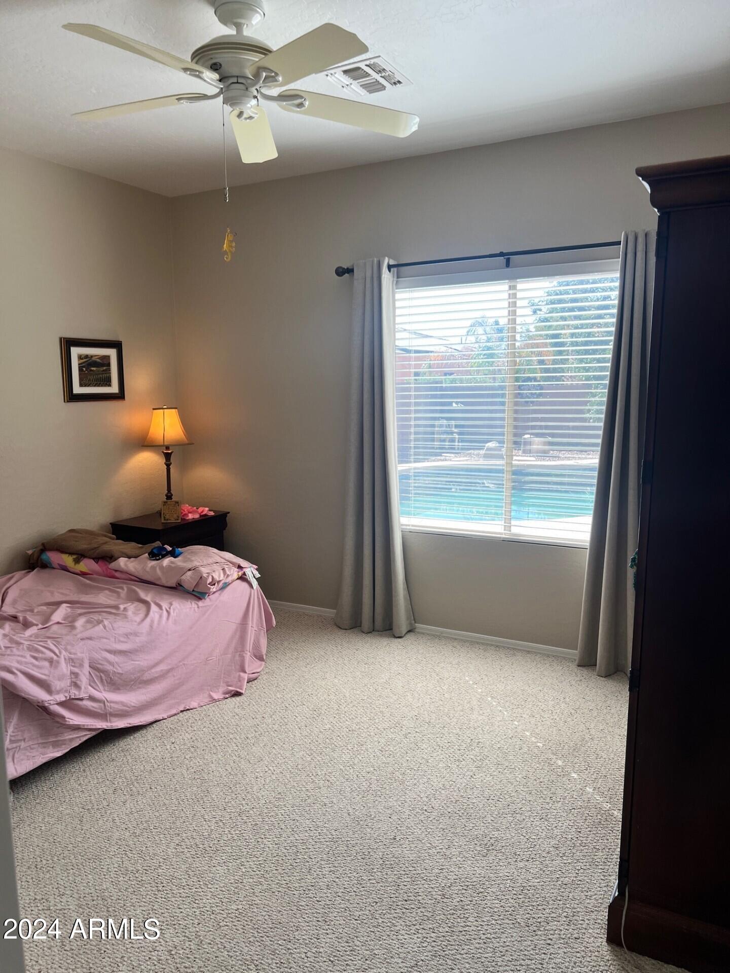2081 East Desert Inn Drive Chandler, AZ 85249 - Photo 16 of 49 a bedroom with a bed and window