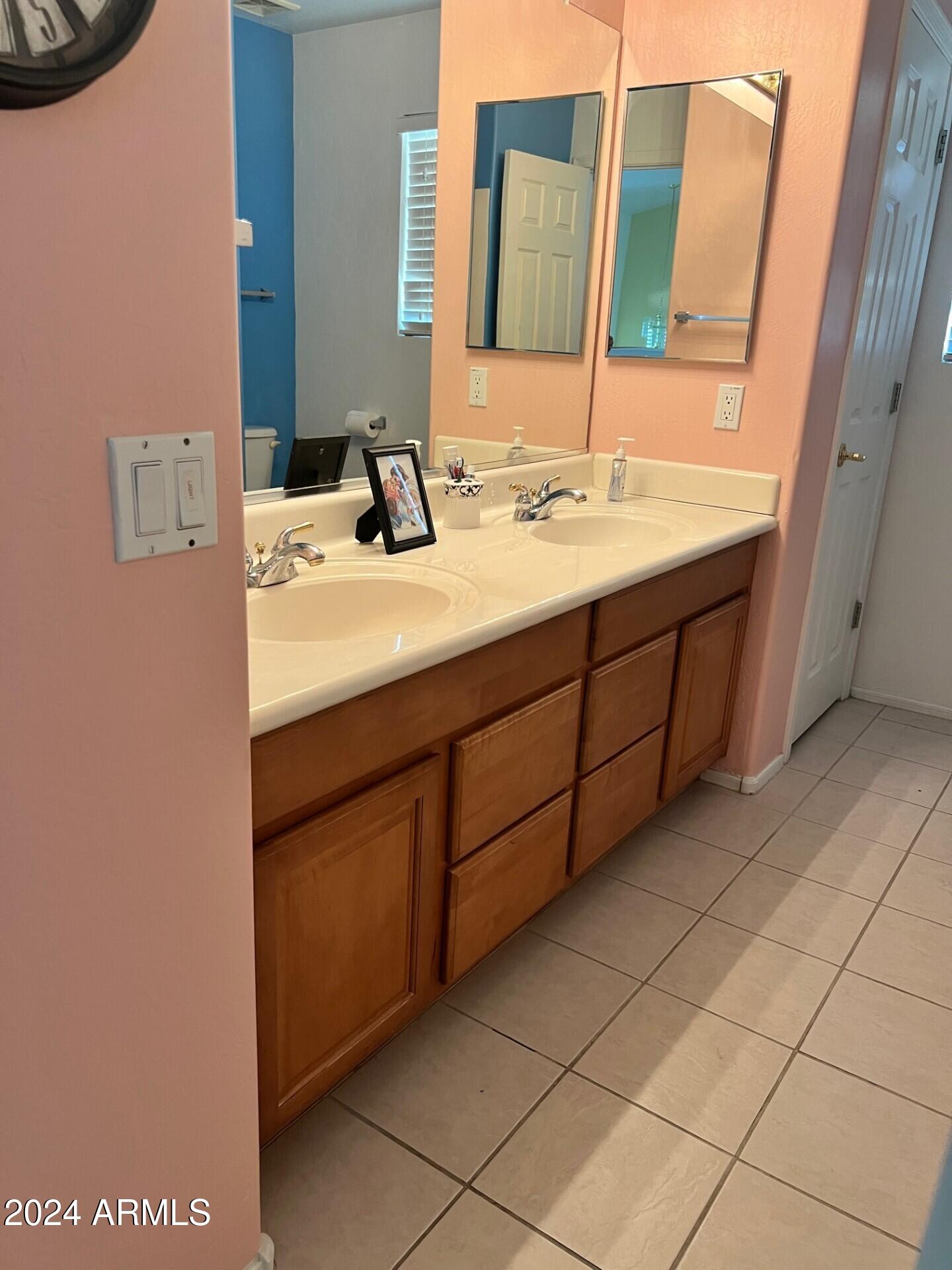 2081 East Desert Inn Drive Chandler, AZ 85249 - Photo 29 of 49 a bathroom with a sink and a mirror