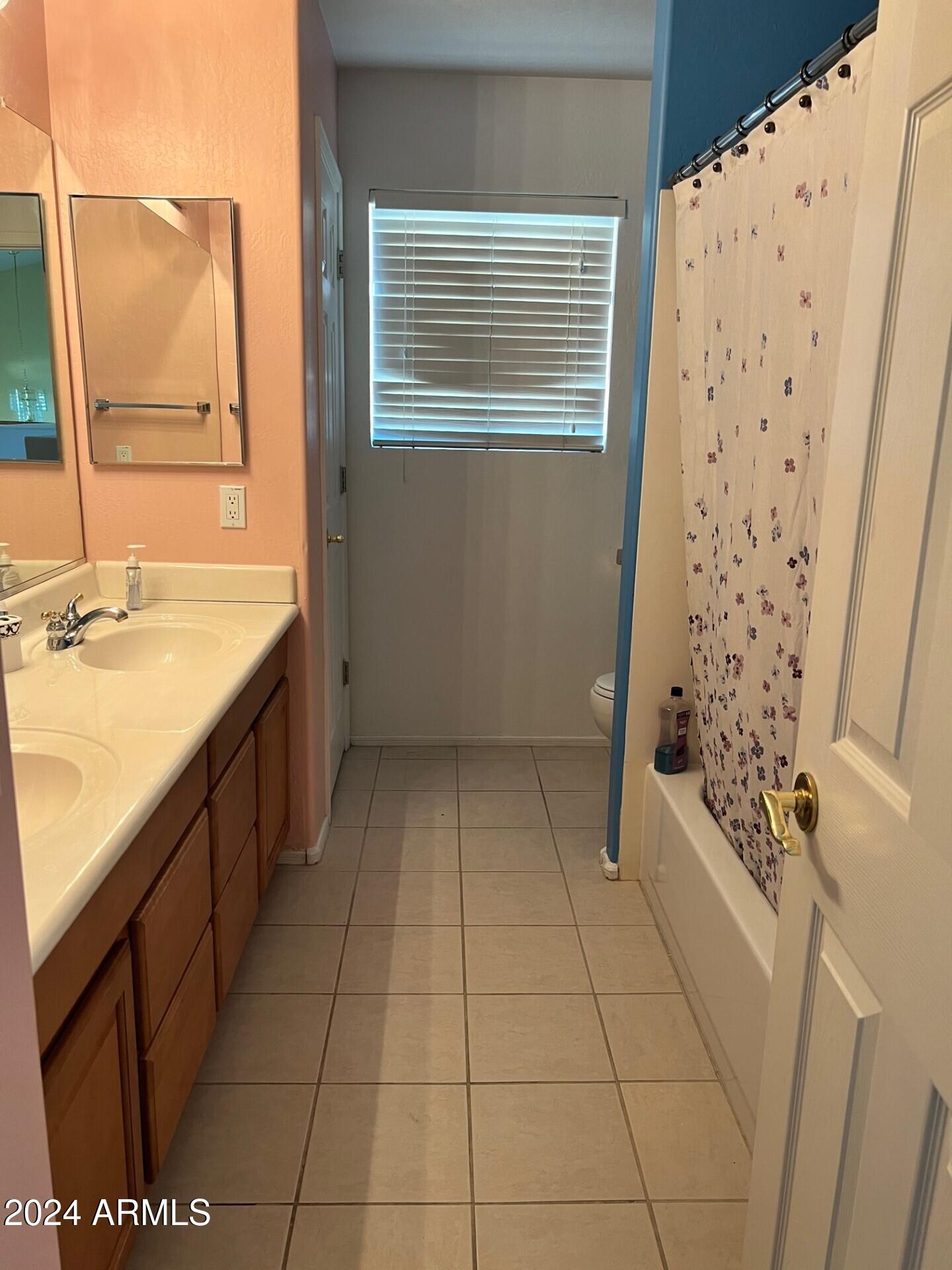 2081 East Desert Inn Drive Chandler, AZ 85249 - Photo 30 of 49 a bathroom with a granite countertop sink a toilet and a mirror