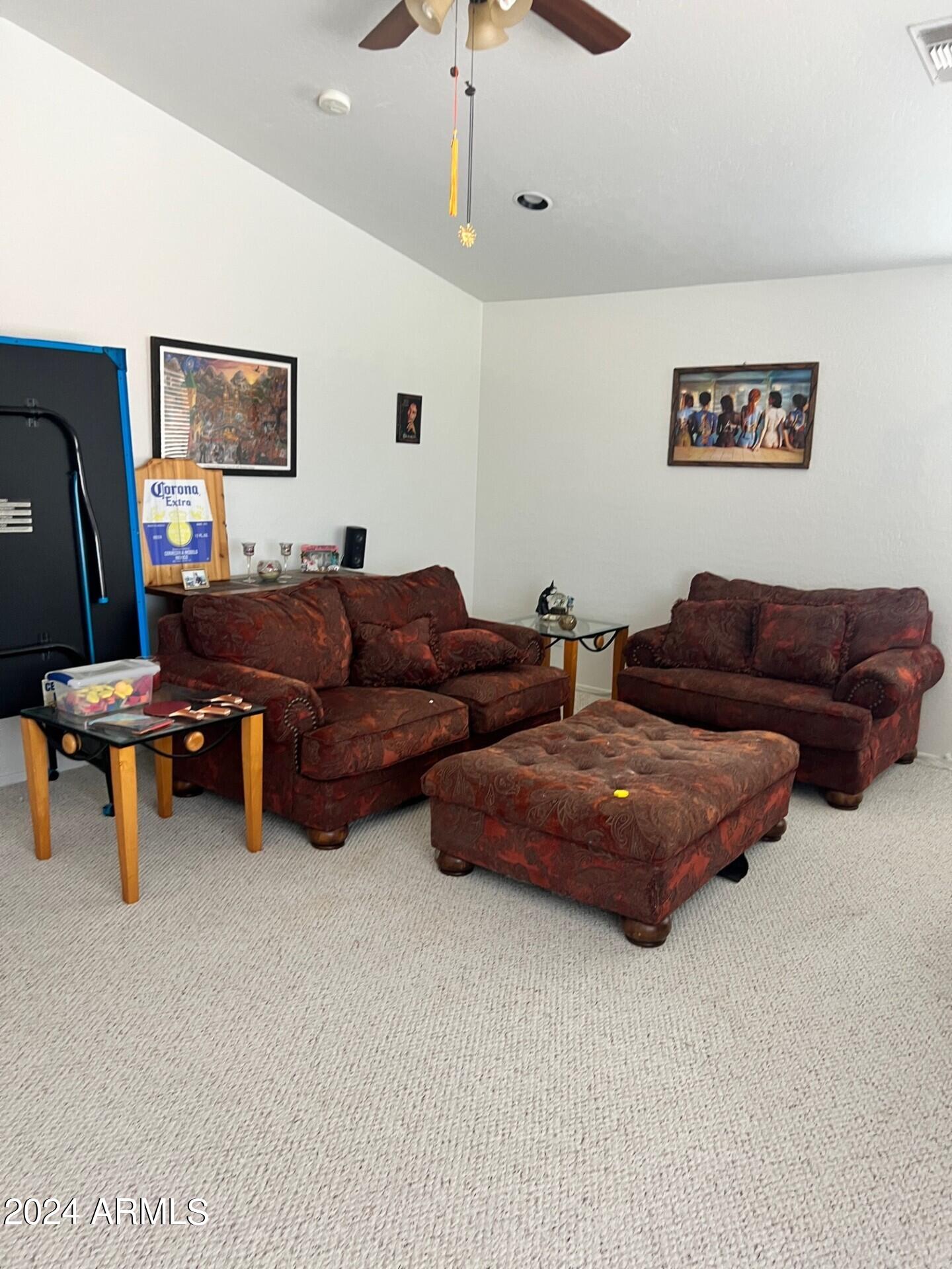 2081 East Desert Inn Drive Chandler, AZ 85249 - Photo 39 of 49 a living room with couches and kitchen view