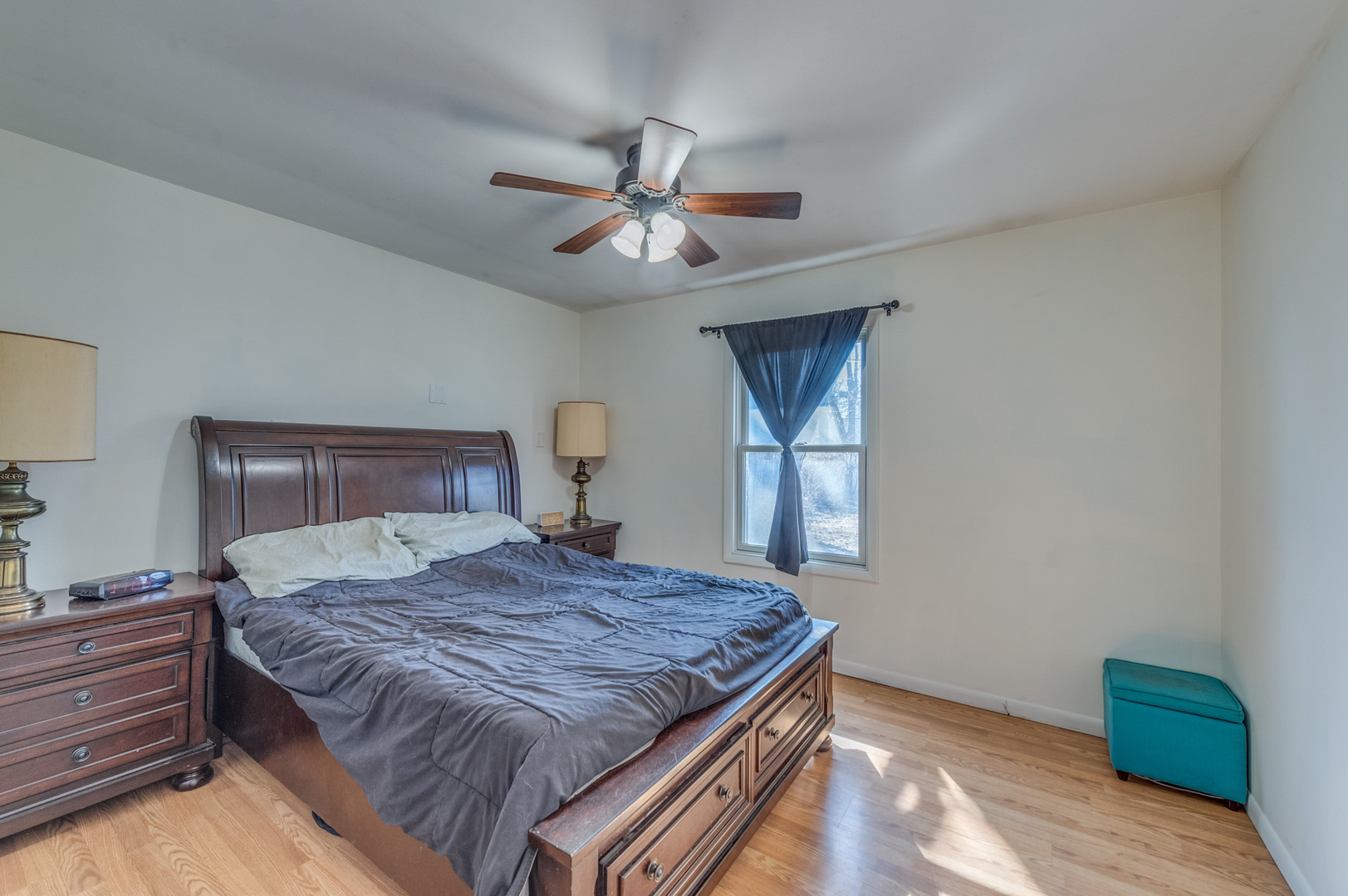 14 Pomeroy Road Montgomery, IL 60538 - Photo 13 of 19 a bedroom with a large bed and a chandelier