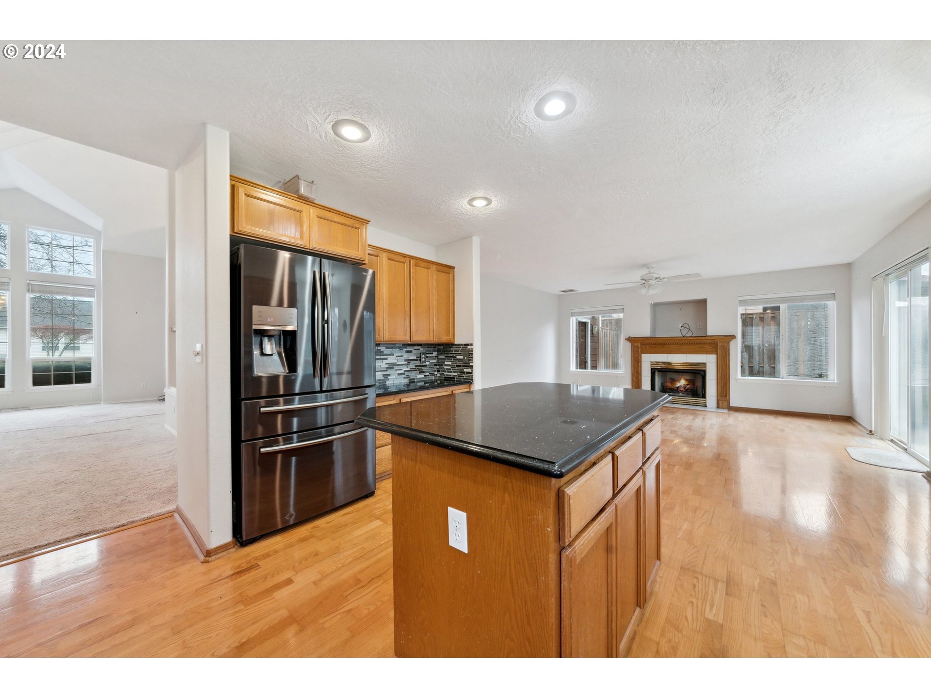 527 Southwest 27th Way Troutdale, OR 97060 - Photo 16 of 41 a kitchen with stainless steel appliances granite countertop a refrigerator a stove and a sink