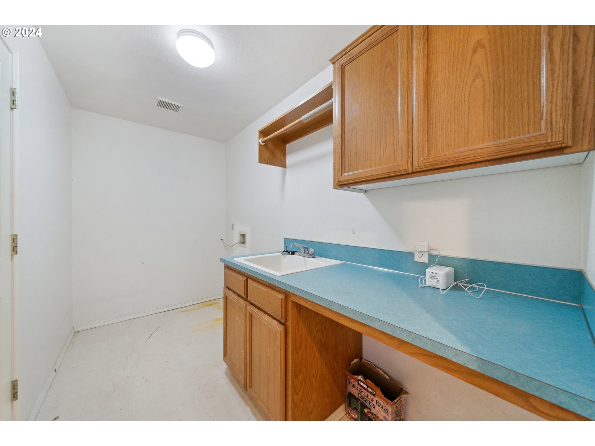 527 Southwest 27th Way Troutdale, OR 97060 - Photo 23 of 41 a kitchen with stainless steel appliances granite countertop a sink and cabinets
