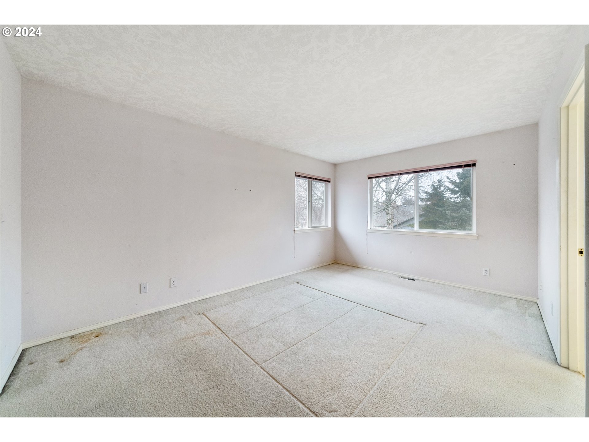 527 Southwest 27th Way Troutdale, OR 97060 - Photo 24 of 41 a view of an empty room with a window
