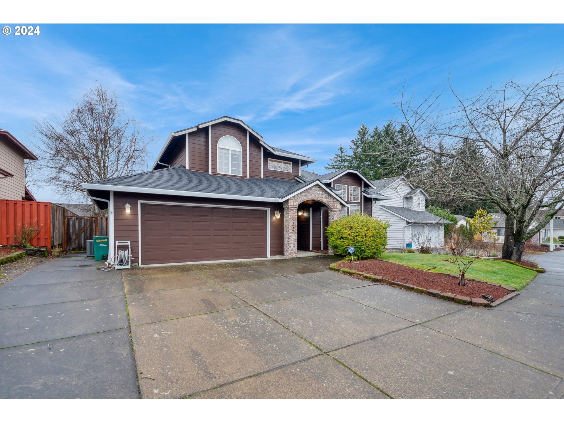 527 Southwest 27th Way Troutdale, OR 97060 - Photo 3 of 41 a front view of a house with a yard and garage