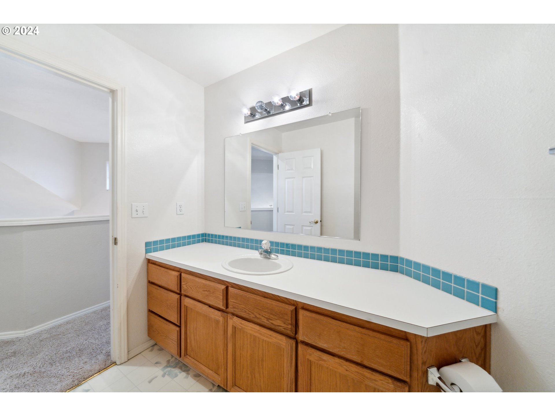 527 Southwest 27th Way Troutdale, OR 97060 - Photo 32 of 41 a bathroom with a sink and a mirror