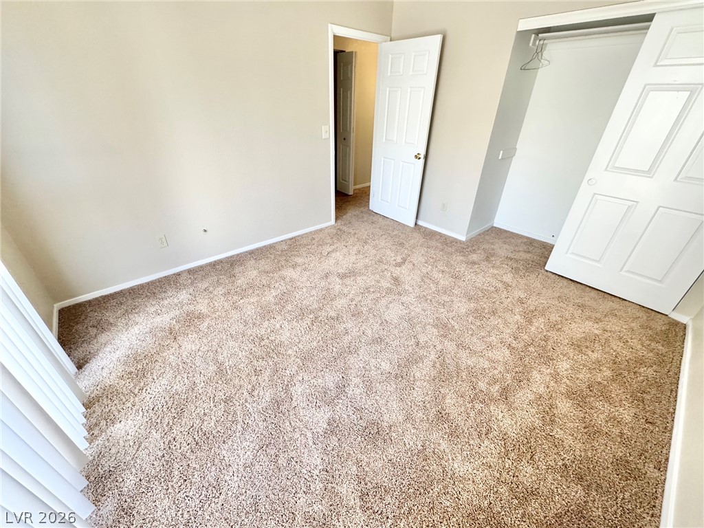 6250 West Flamingo Road, Unit 109 Las Vegas, NV 89103 - Photo 15 of 18 A well-maintained carpeted bedroom awaits your personal touch.