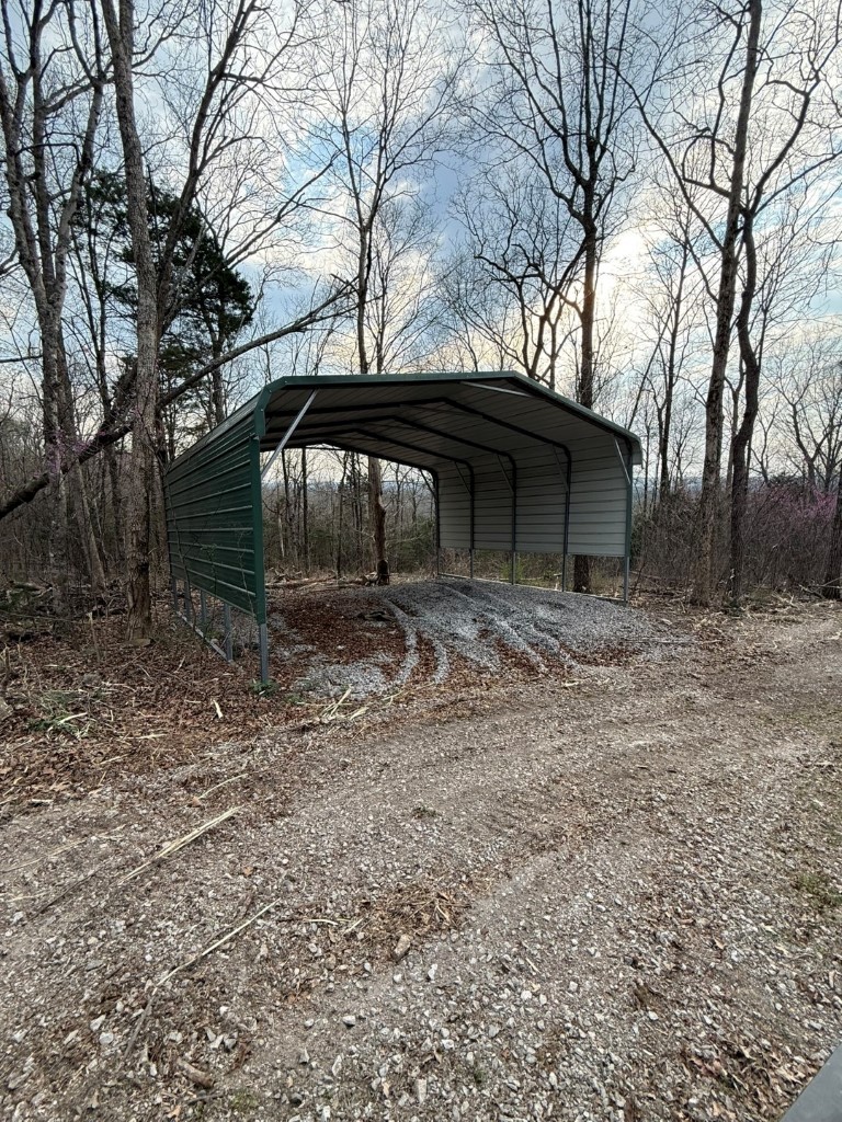 1320 McElroy Road Readyville, TN 37149 - Photo 13 of 23 a front view of a house with garden