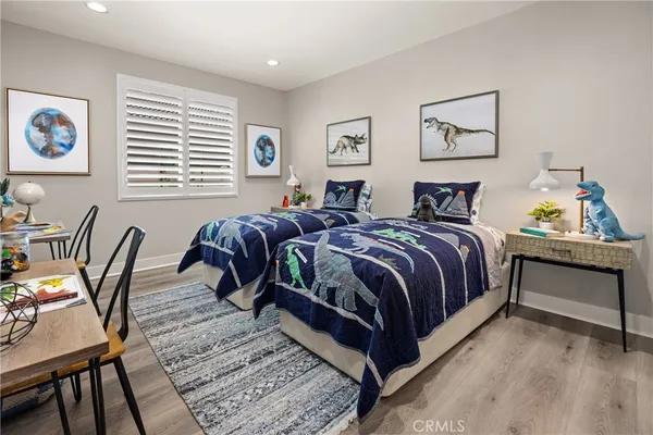 a bedroom with a bed and a table