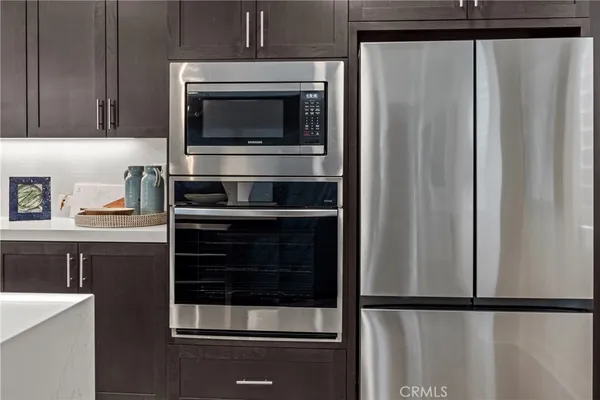 a kitchen with appliances and a cabinet