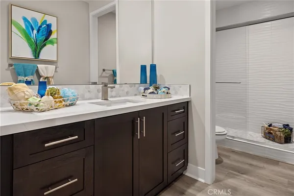 a bathroom with a sink a vanity and a mirror