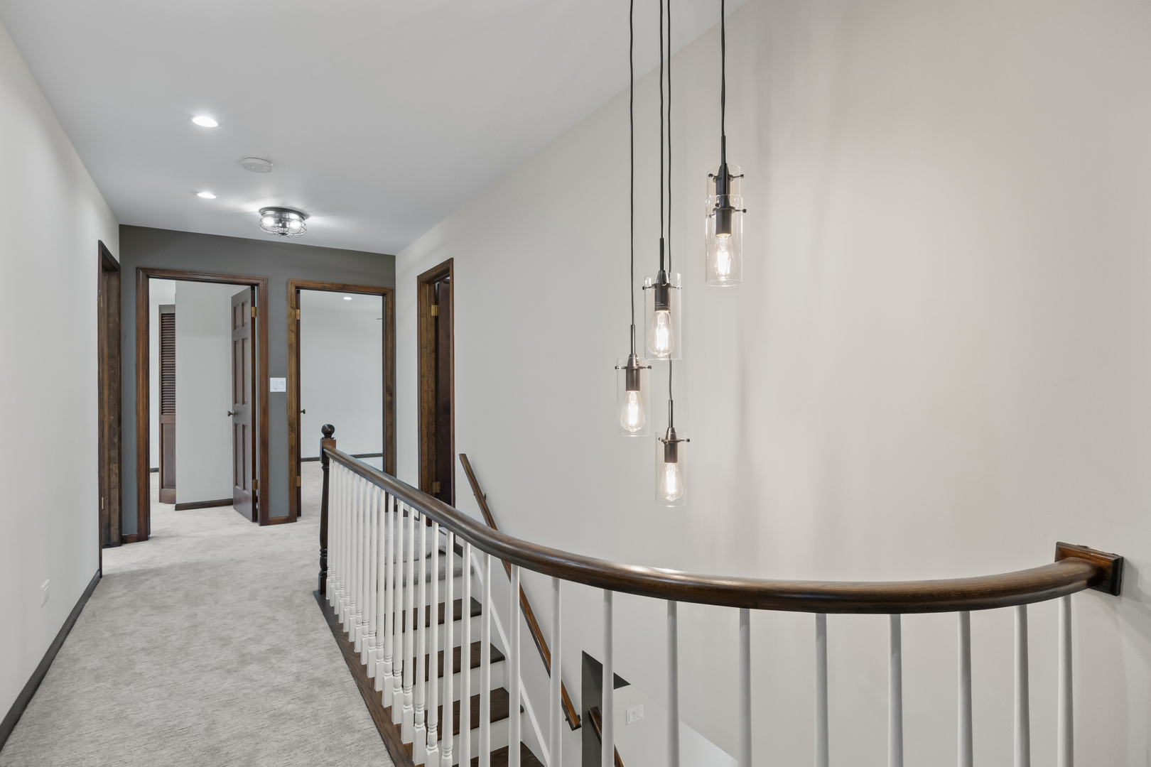 2117 Greenock Street Inverness, IL 60067 - Photo 20 of 58 a view of a hallway with wooden floor and stairs