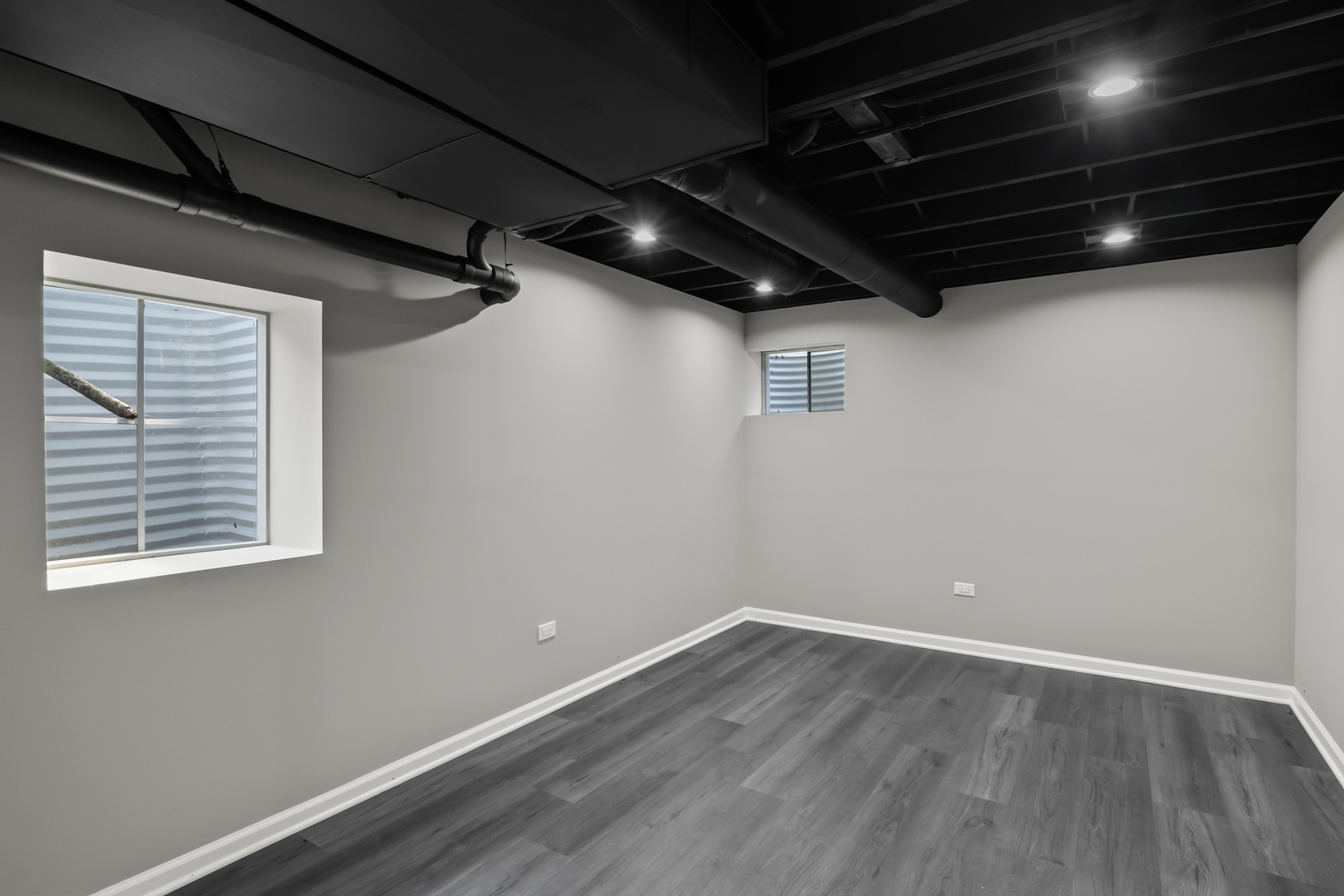 2117 Greenock Street Inverness, IL 60067 - Photo 39 of 58 a view of an empty room with wooden floor and a window