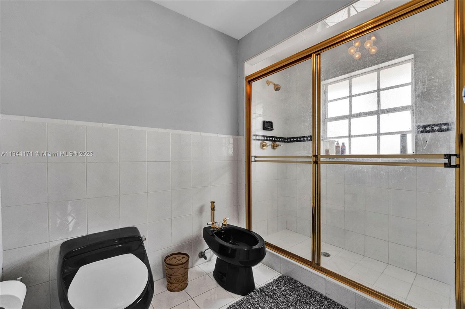 20100 Red Run Drive Hialeah, FL 33015 - Photo 16 of 61 a bathroom with a toilet