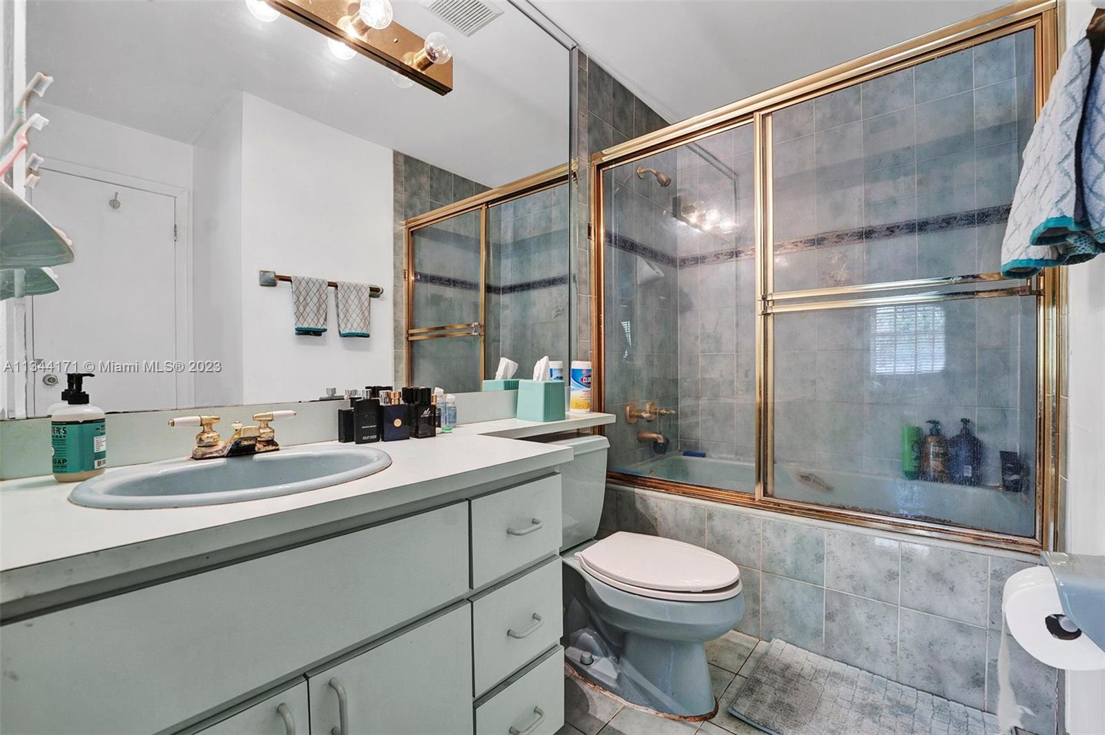 20100 Red Run Drive Hialeah, FL 33015 - Photo 20 of 61 a bathroom with a sink a toilet and shower