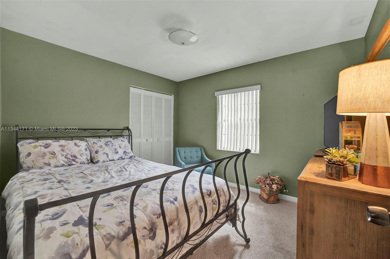 20100 Red Run Drive Hialeah, FL 33015 - Photo 21 of 61 a bedroom with a bed and a window