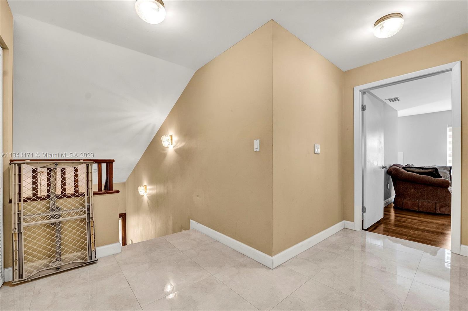 20100 Red Run Drive Hialeah, FL 33015 - Photo 26 of 61 a view of a hallway to room with staircase