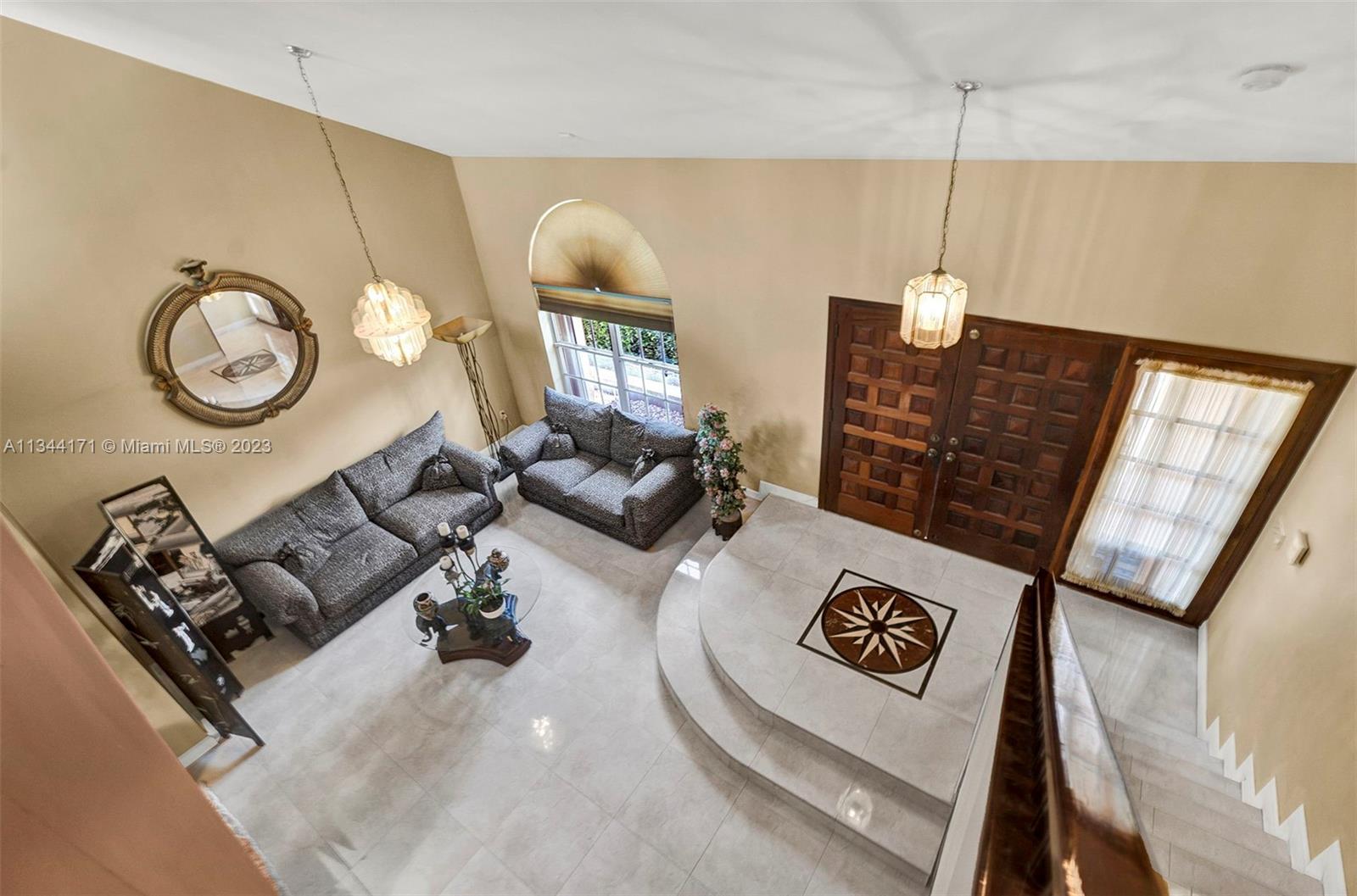 20100 Red Run Drive Hialeah, FL 33015 - Photo 27 of 61 a living room with furniture and a large window