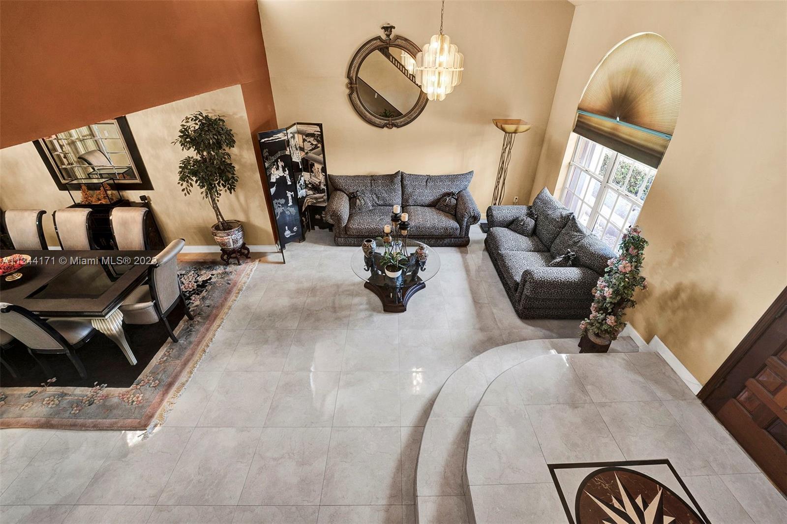 20100 Red Run Drive Hialeah, FL 33015 - Photo 28 of 61 a living room with furniture and a mirror