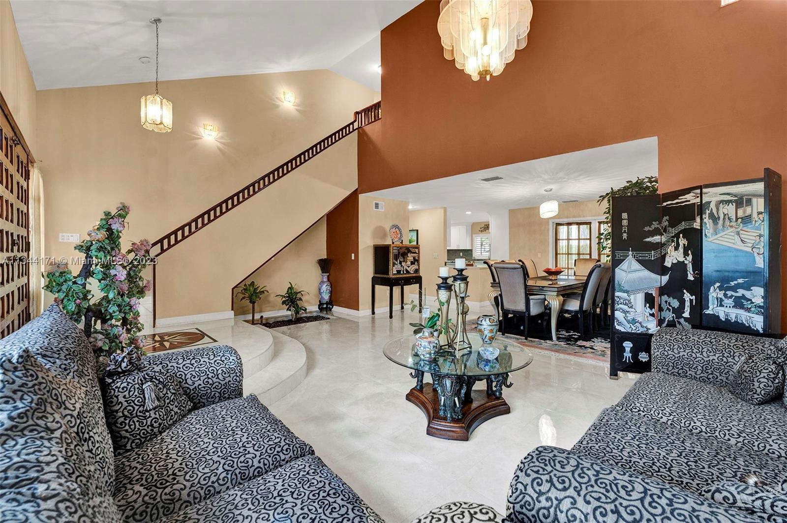 20100 Red Run Drive Hialeah, FL 33015 - Photo 31 of 61 a living room with furniture kitchen view and a chandelier