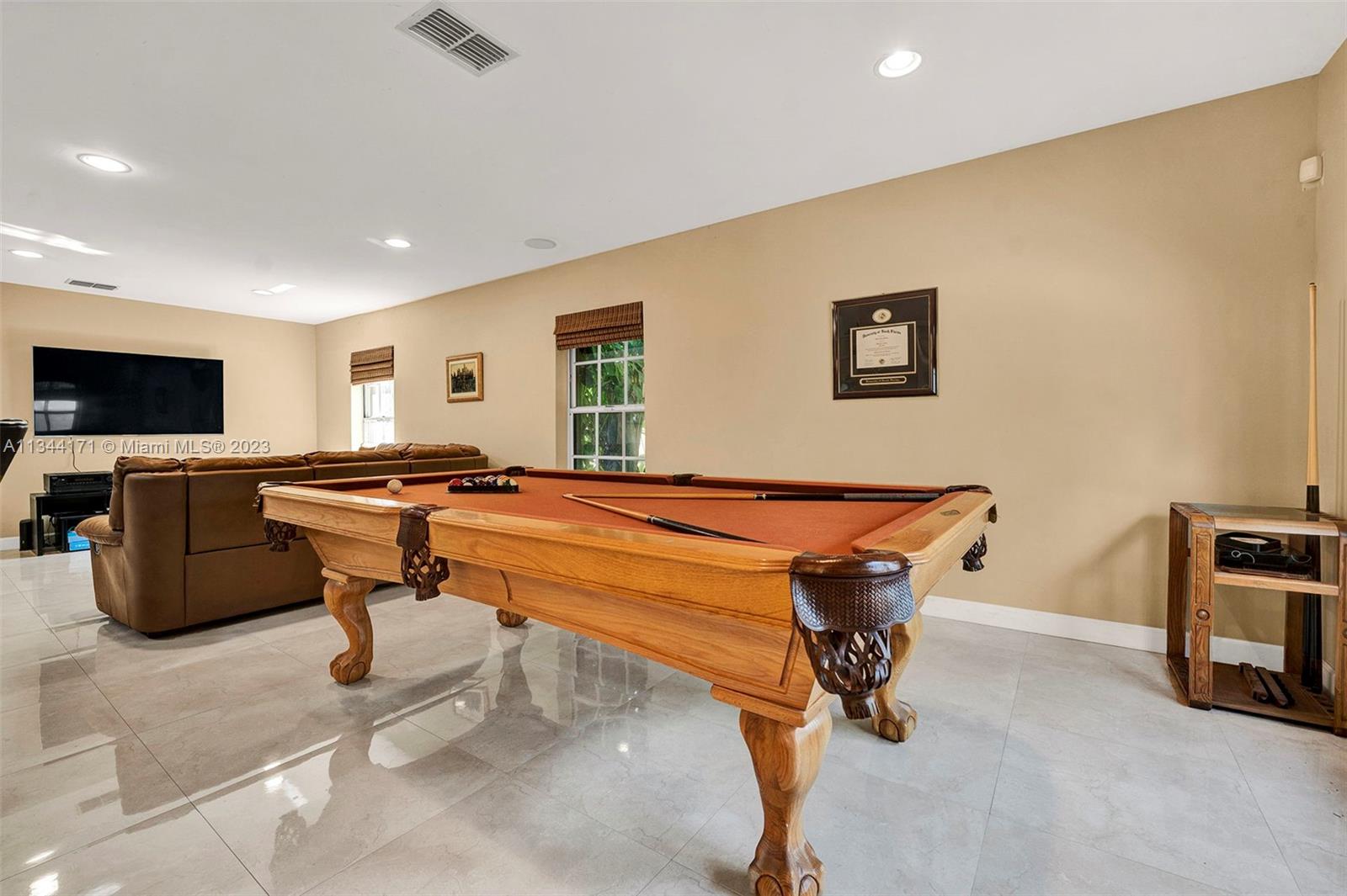 20100 Red Run Drive Hialeah, FL 33015 - Photo 36 of 61 a room with furniture pool table and flat screen tv