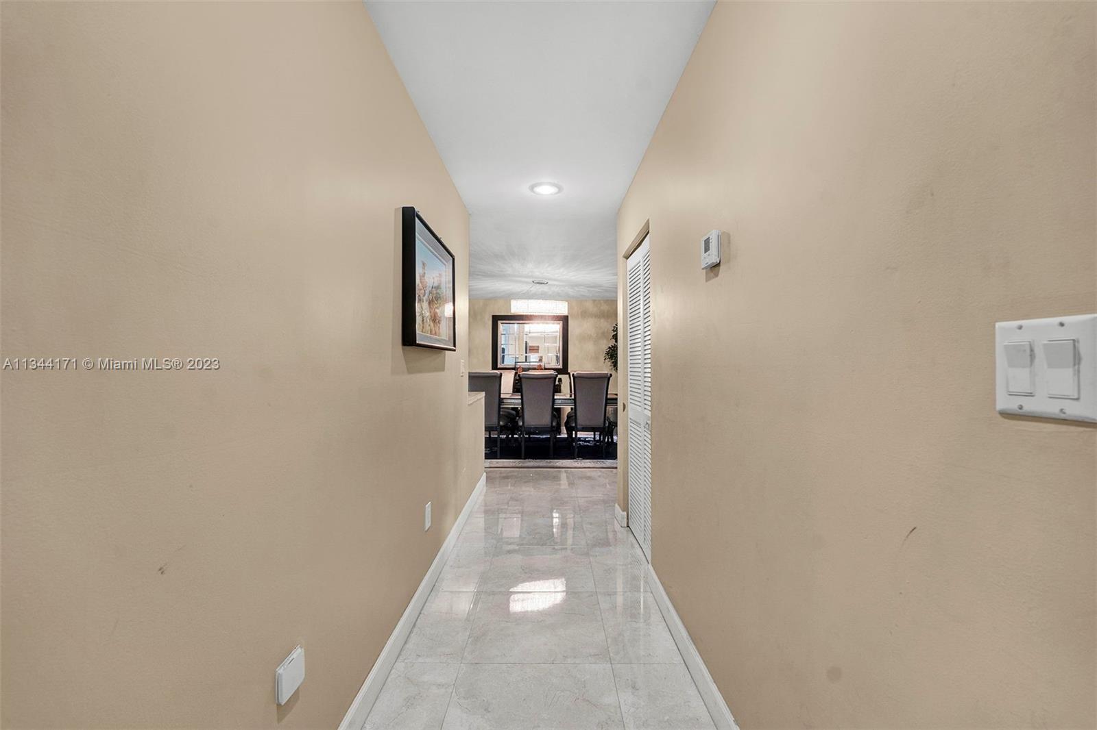 20100 Red Run Drive Hialeah, FL 33015 - Photo 38 of 61 a view of a hallway with wooden floor