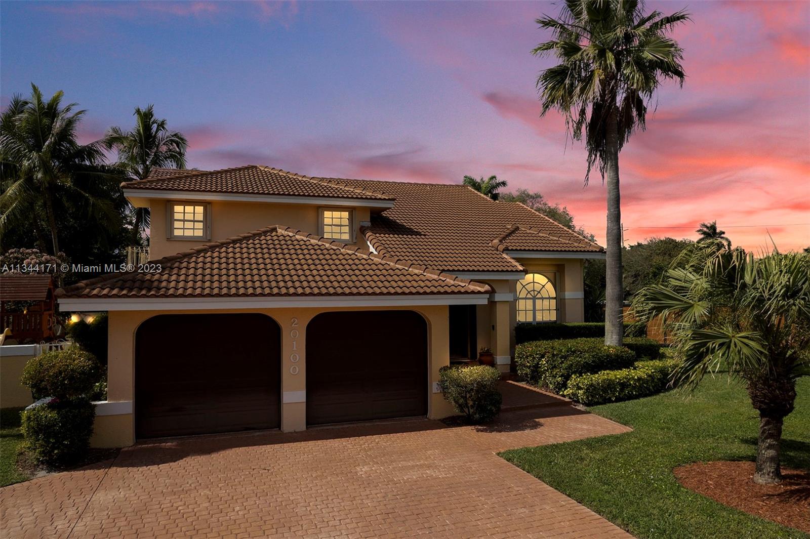20100 Red Run Drive Hialeah, FL 33015 - Photo 4 of 61 a front view of a house with yard and garage