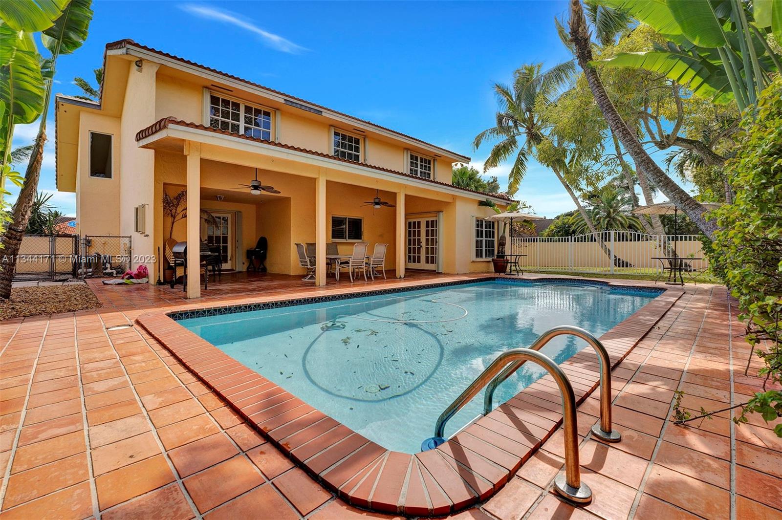 20100 Red Run Drive Hialeah, FL 33015 - Photo 45 of 61 front view of a house with a swimming pool