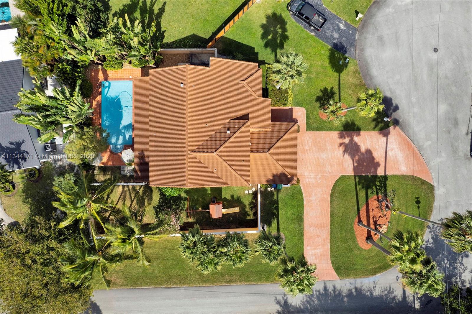 20100 Red Run Drive Hialeah, FL 33015 - Photo 54 of 61 an aerial view of a house with a yard and garden