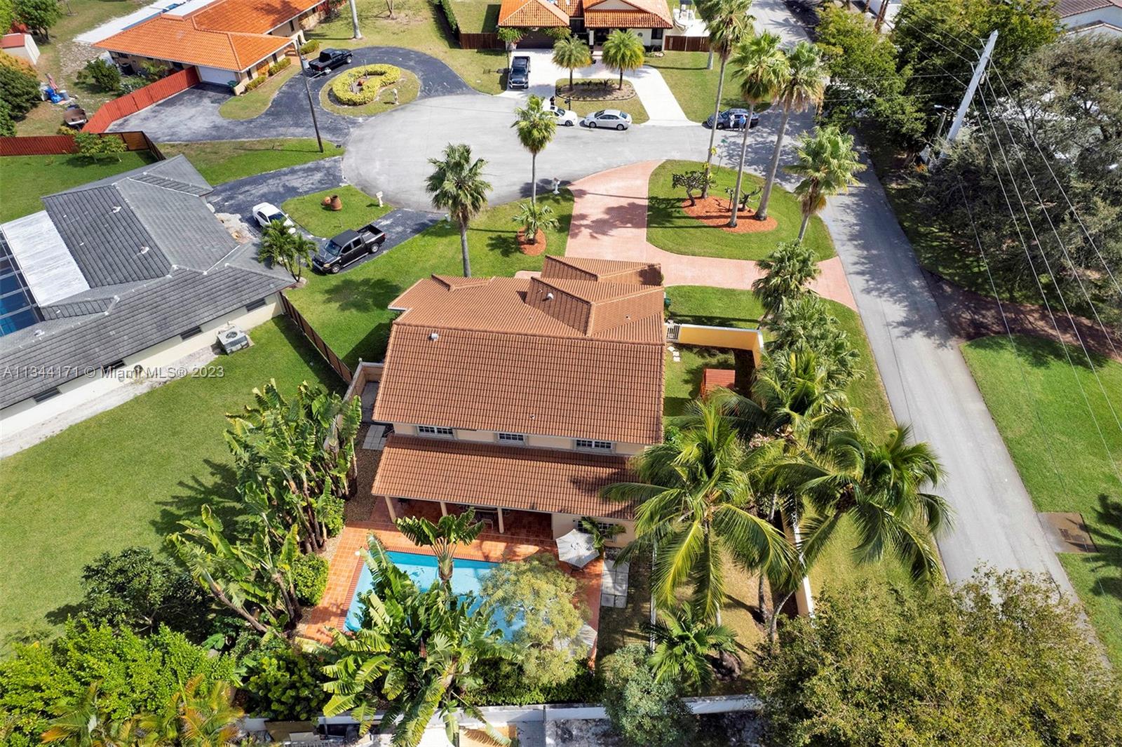 20100 Red Run Drive Hialeah, FL 33015 - Photo 55 of 61 an aerial view of a house with a yard and swimming pool