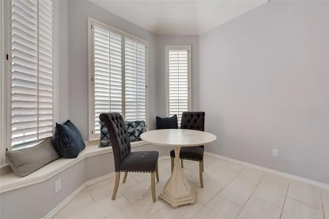 a view of a dining room with furniture and window