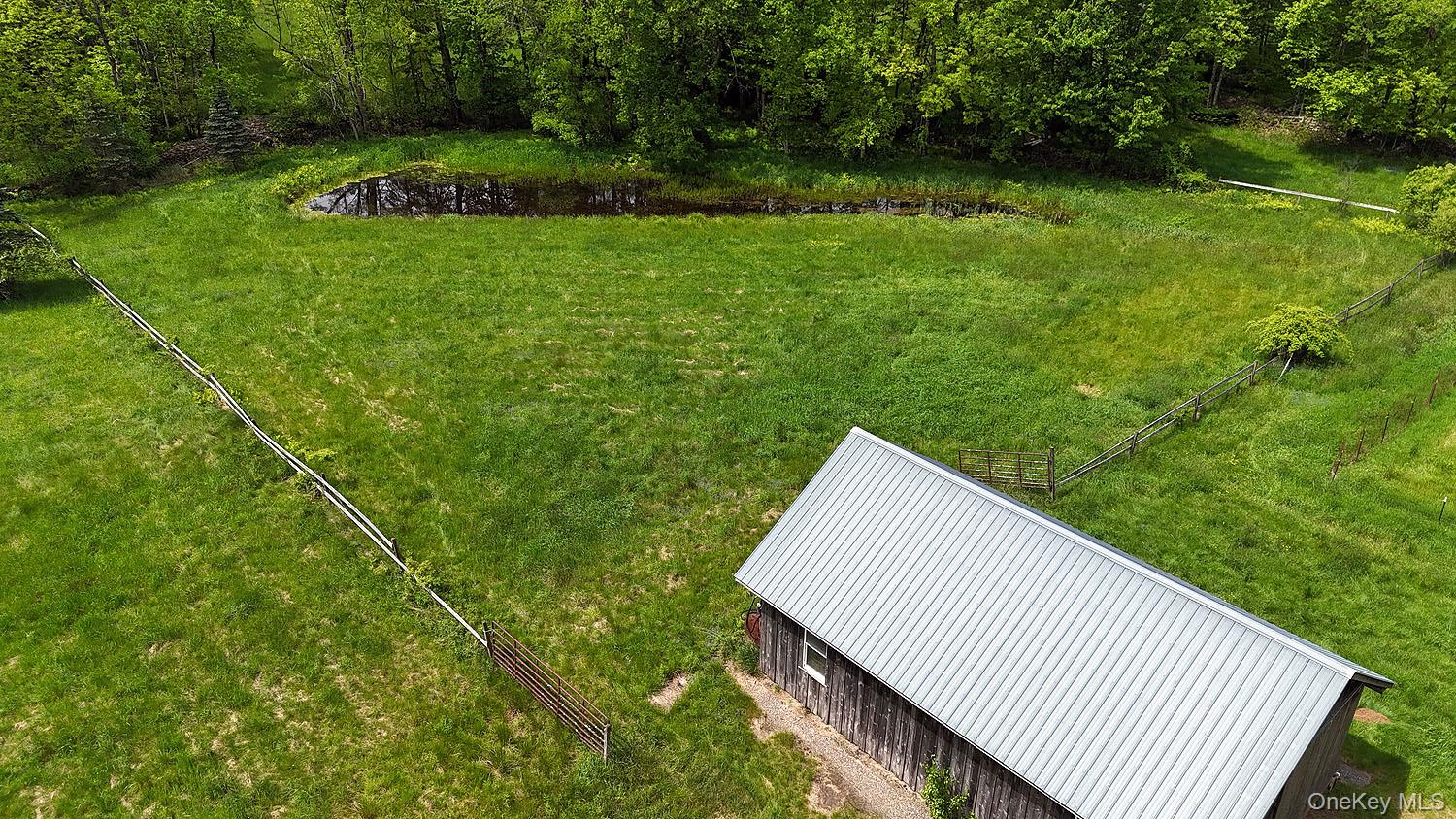 Menges Road Livingston Manor, NY 12791 - Photo 22 of 32 a view of a backyard with a garden and entertaining space