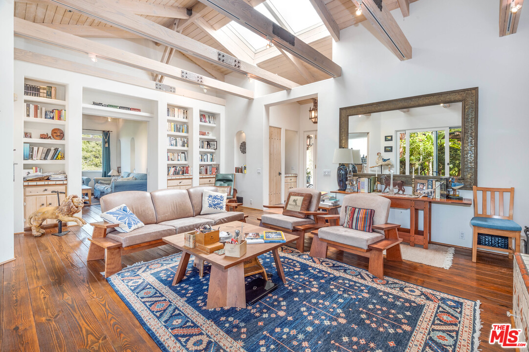 a living room with furniture and a rug