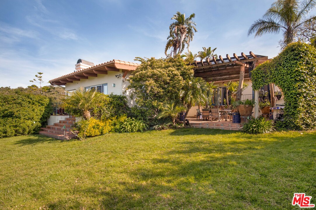 20333 Reigate Road Topanga, CA 90290 - Photo 11 of 21 a view of a house with a yard