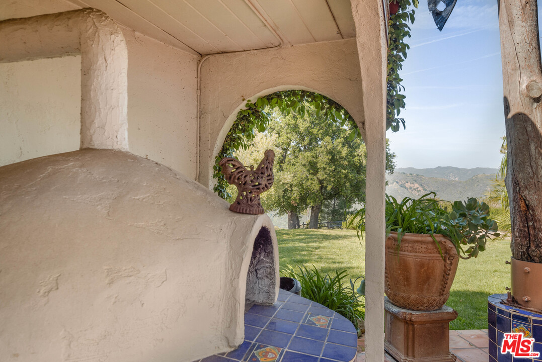 20333 Reigate Road Topanga, CA 90290 - Photo 14 of 21 a view of a yard with fountain in front of it