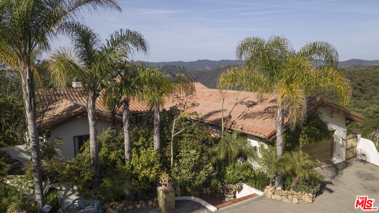 20333 Reigate Road Topanga, CA 90290 - Photo 21 of 21 a view of a houses with a yard