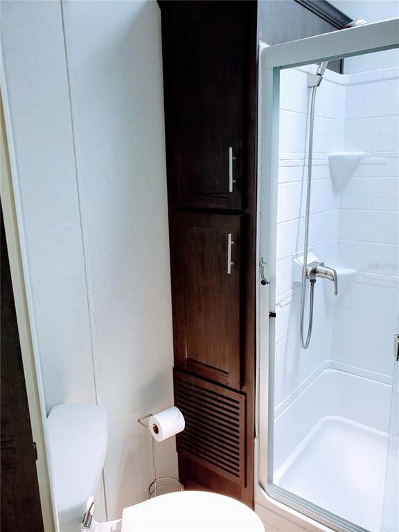 3000 Clarcona Road, Unit 2710 Apopka, FL 32703 - Photo 15 of 30 a bathroom with a toilet and a shower