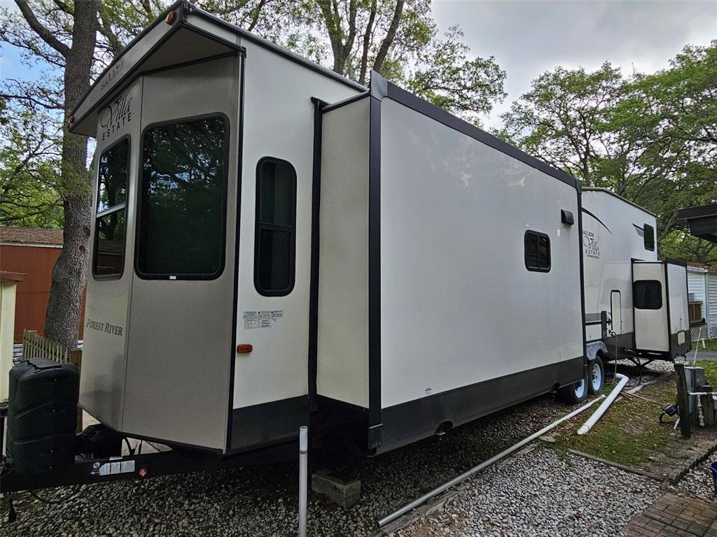 3000 Clarcona Road, Unit 2710 Apopka, FL 32703 - Photo 2 of 30 a front view of a house with garden
