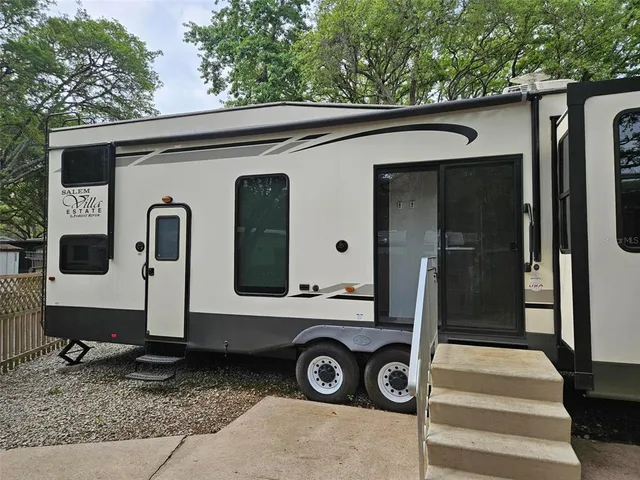 a front view of a house with parking area