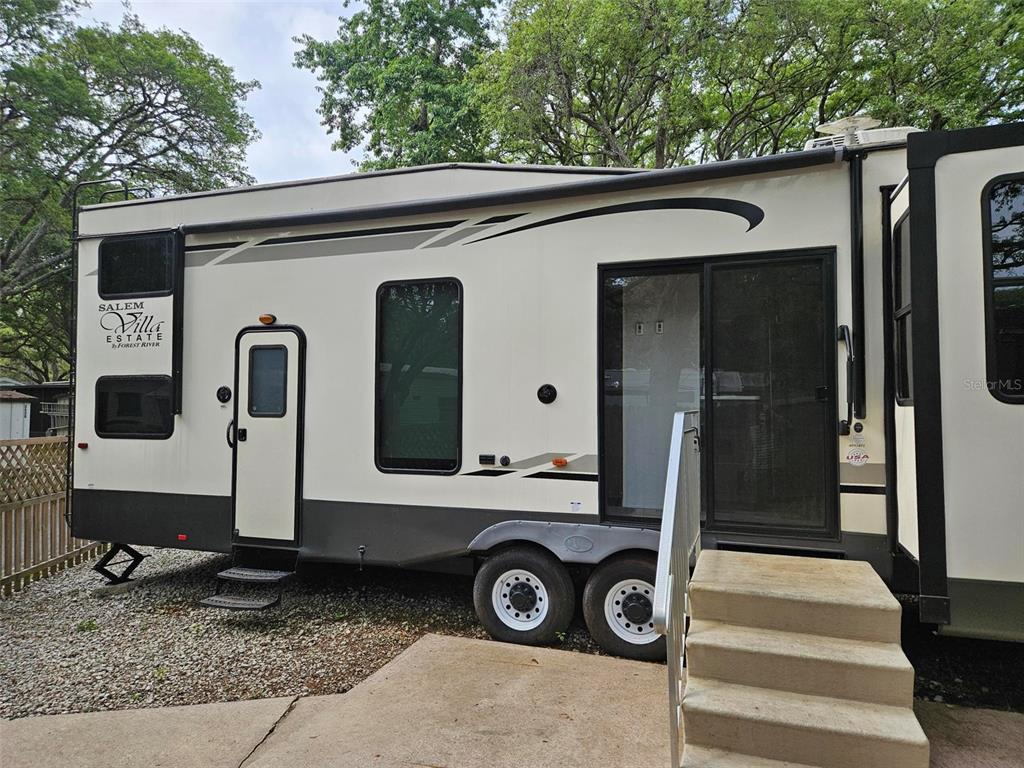 3000 Clarcona Road, Unit 2710 Apopka, FL 32703 - Photo 5 of 30 a front view of a house with parking area