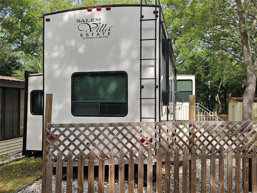 3000 Clarcona Road, Unit 2710 Apopka, FL 32703 - Photo 6 of 30 a front view of a house with a fence