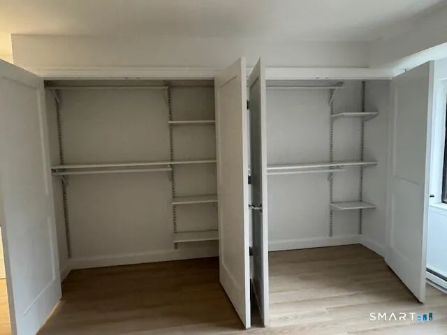 a view of an empty walk in closet