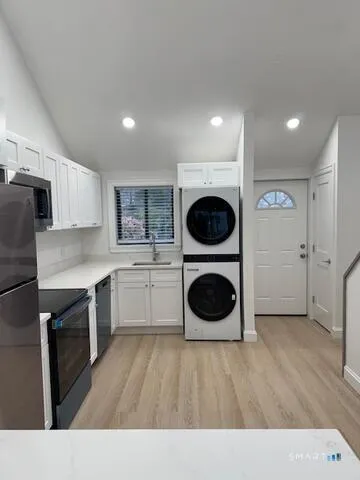 a kitchen with a washer and dryer