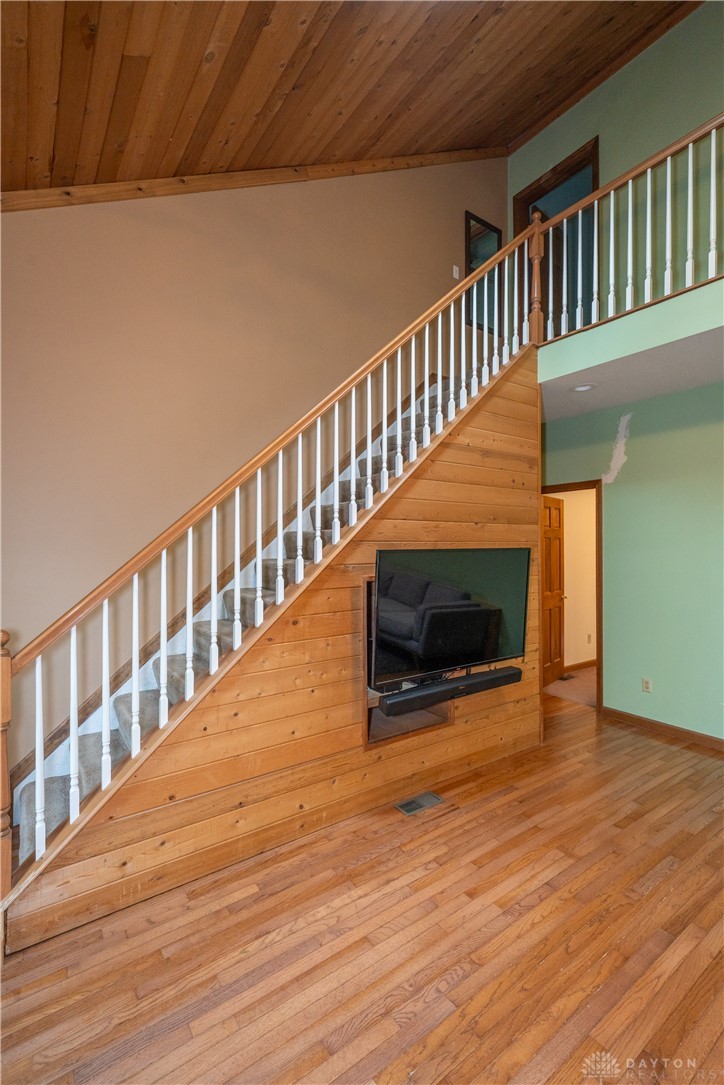 10584 New Biddinger Road Harrison, OH 45030 - Photo 19 of 61 This interior offers a grand staircase and beautiful hardwood floors throughout the living area.