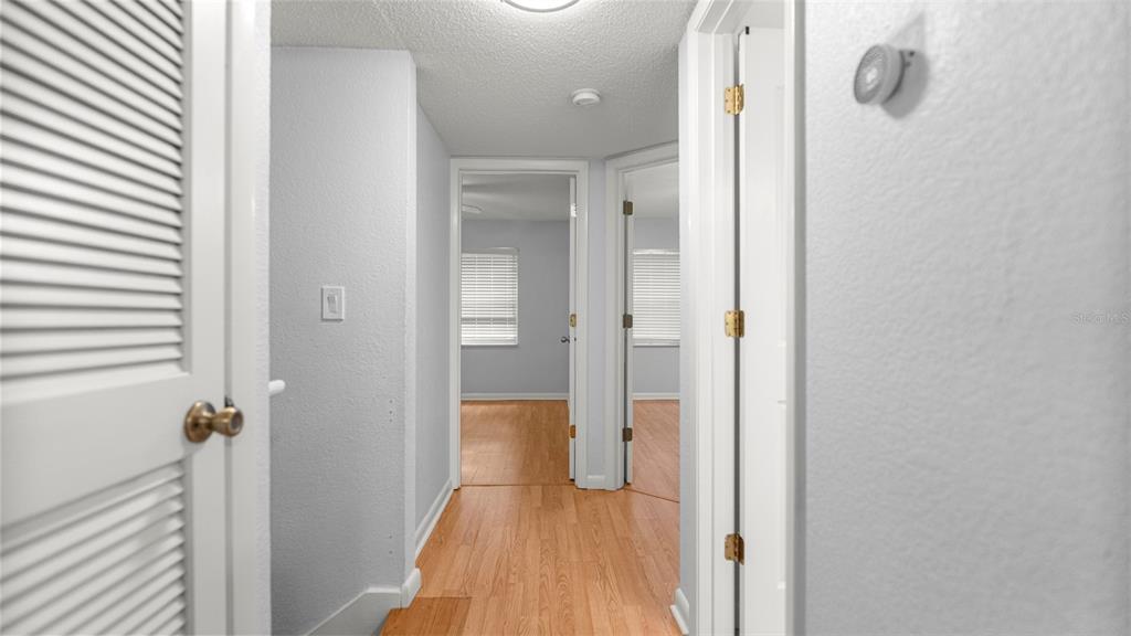 501 Southwest 75th Street, Unit B5 Gainesville, FL 32607 - Photo 20 of 38 a view of a bathroom from a hallway