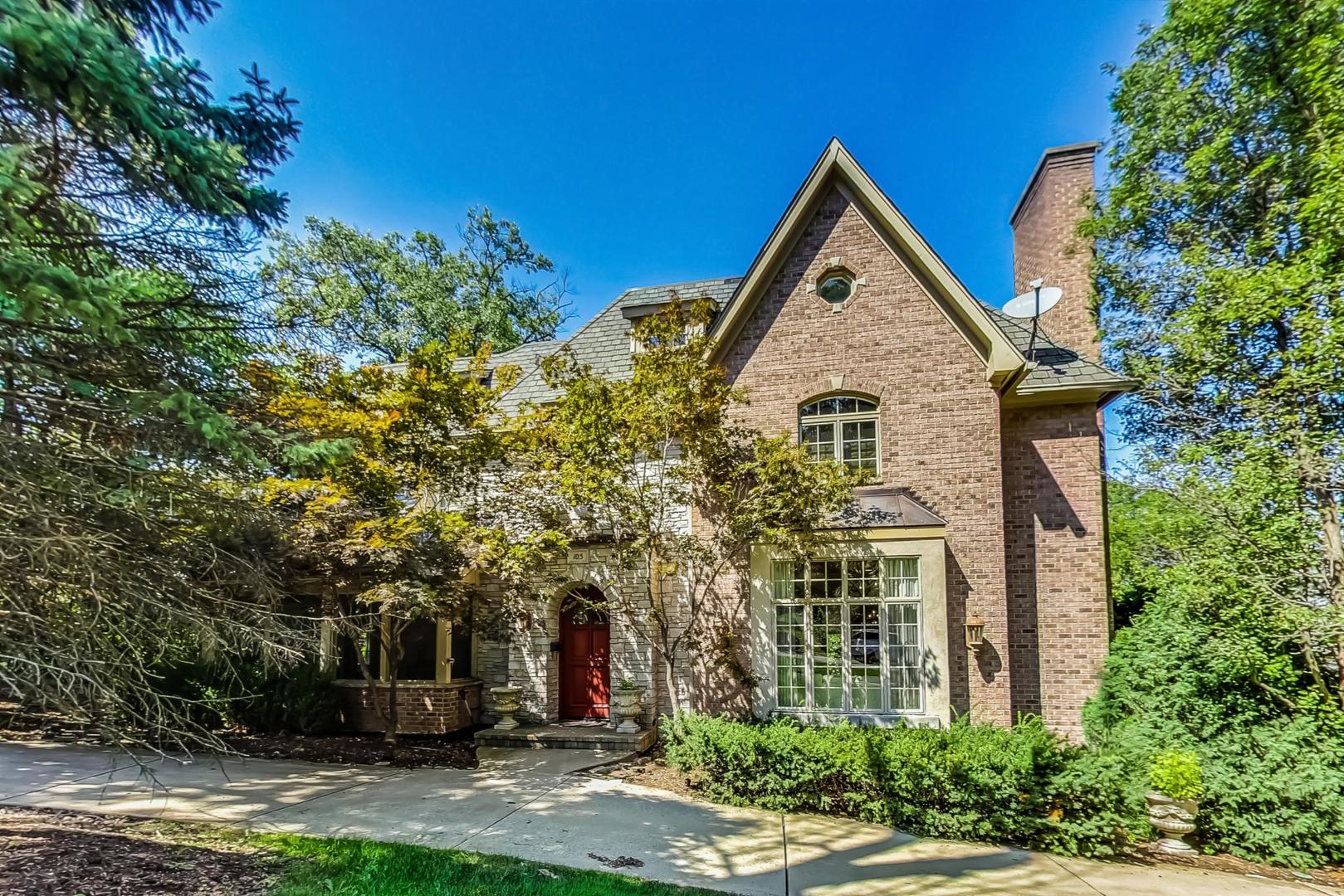 105 Fuller Road Hinsdale, IL 60521 - Photo 1 of 57 a front view of a house with a yard