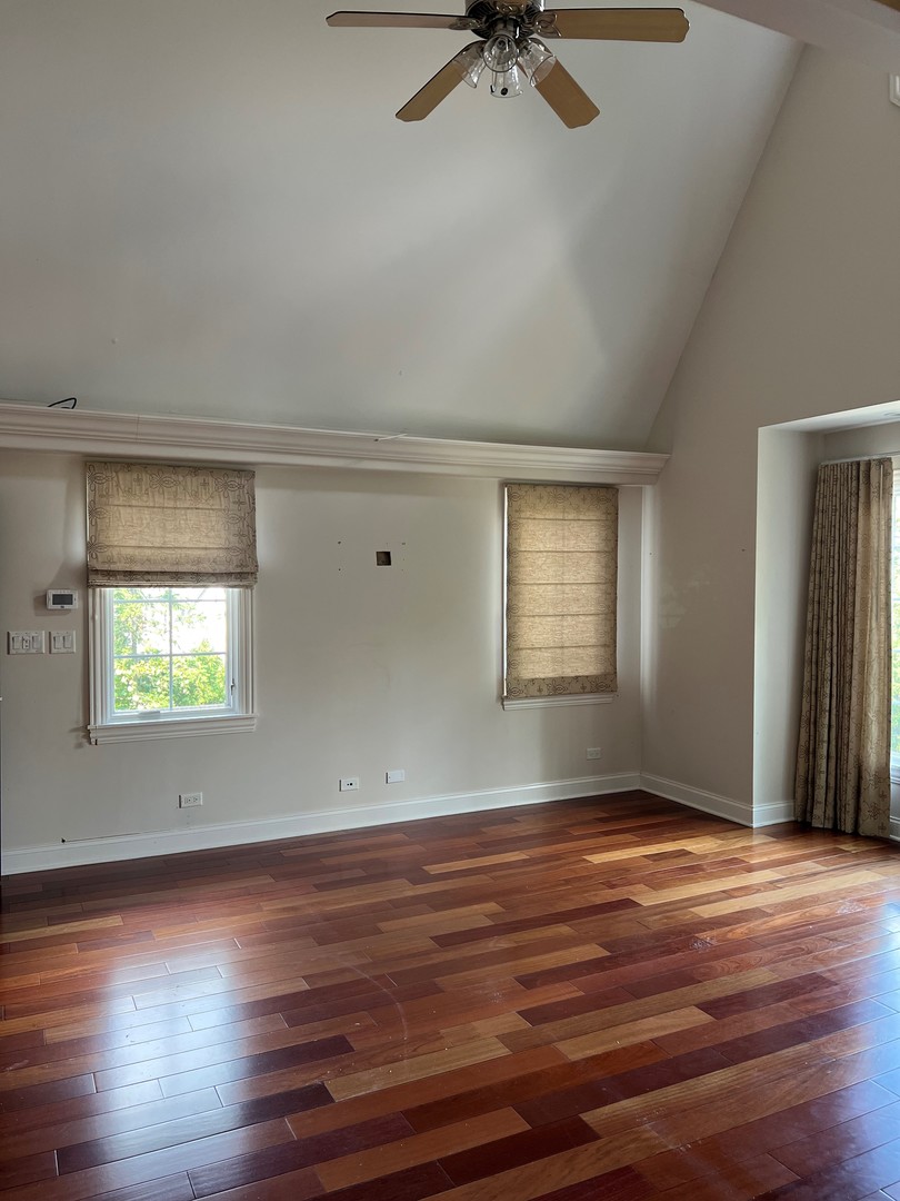 105 Fuller Road Hinsdale, IL 60521 - Photo 25 of 57 an empty room with wooden floor closet and windows