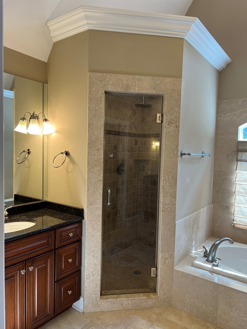 105 Fuller Road Hinsdale, IL 60521 - Photo 30 of 57 a bathroom with a granite countertop sink a mirror and shower