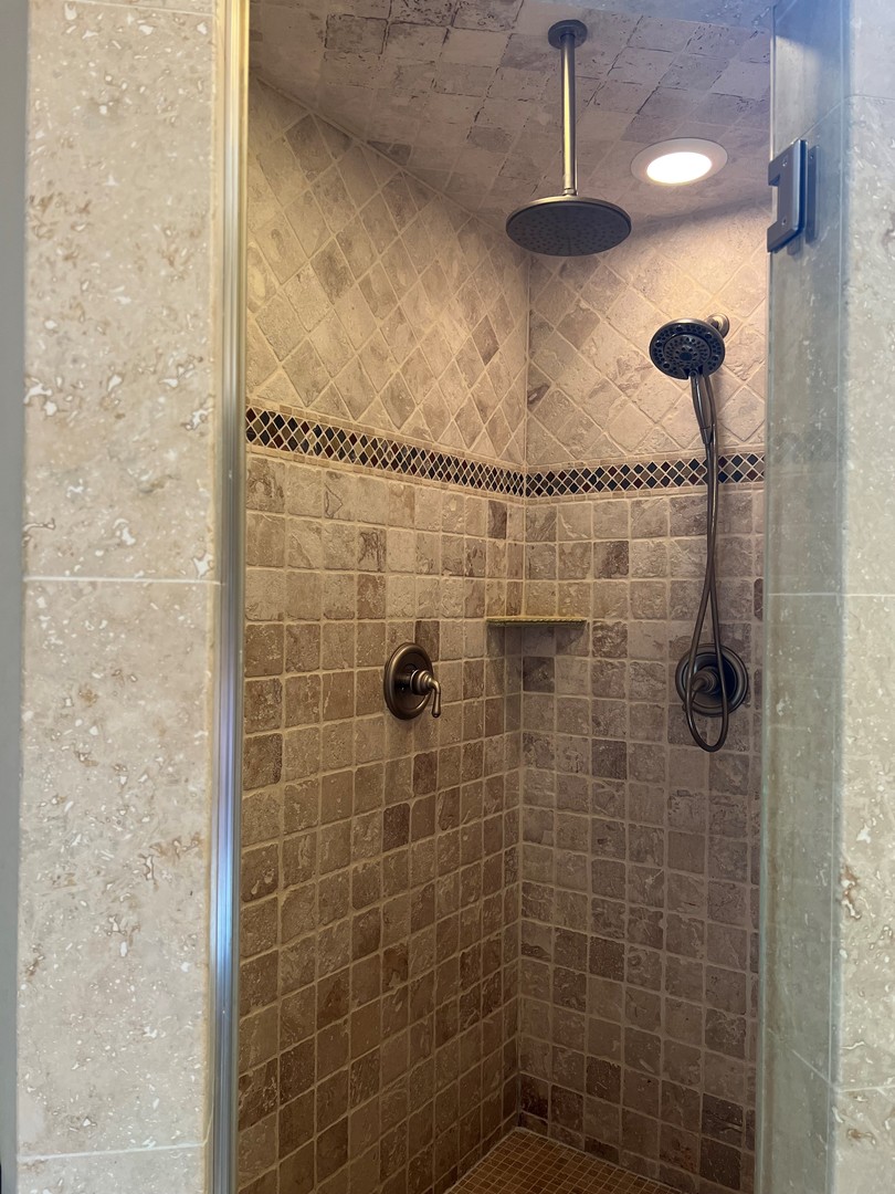 105 Fuller Road Hinsdale, IL 60521 - Photo 31 of 57 a bathroom with a shower